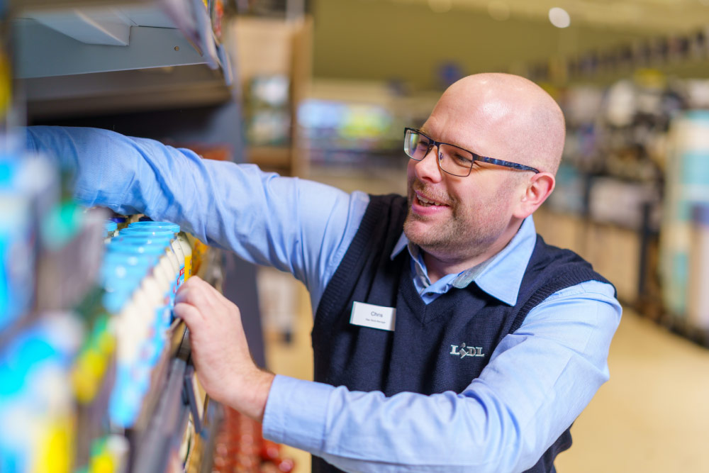 Lidl staff stacking shelves